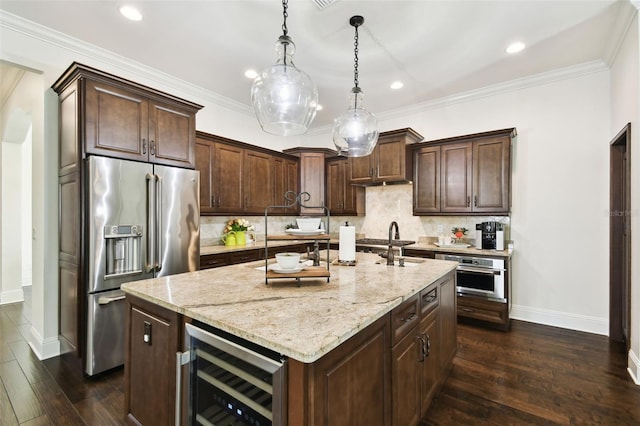 kitchen featuring stainless steel appliances, dark wood-style floors, baseboards, light stone countertops, and wine cooler