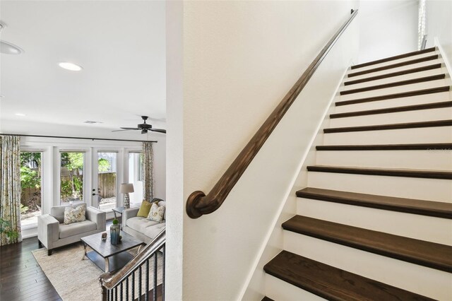 stairs with hardwood / wood-style floors, ceiling fan, and recessed lighting