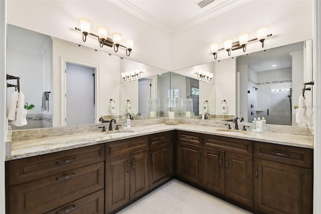 bathroom with double vanity, visible vents, a stall shower, and a sink