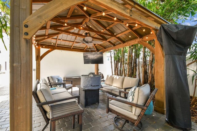 view of patio with a gazebo, ceiling fan, and outdoor lounge area