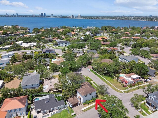 aerial view with a residential view, a water view, and a city view