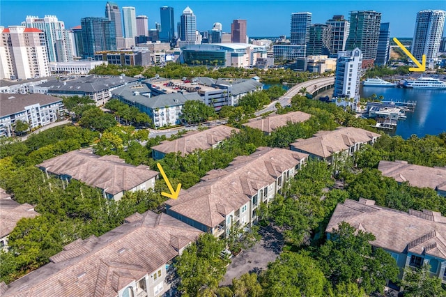 drone / aerial view featuring a view of city and a water view