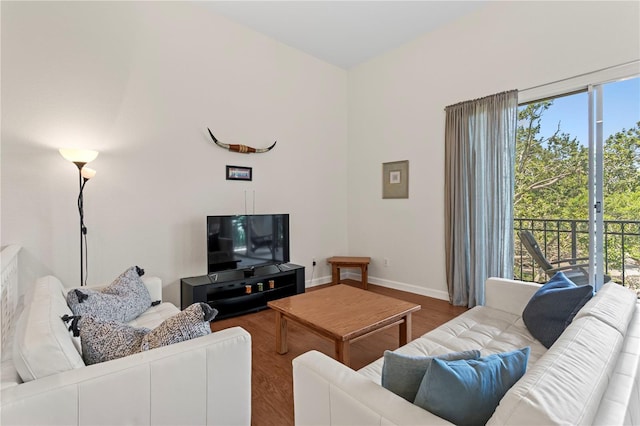 living room featuring baseboards and wood finished floors