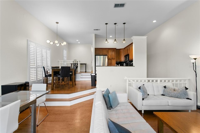 living area with visible vents and light wood-type flooring