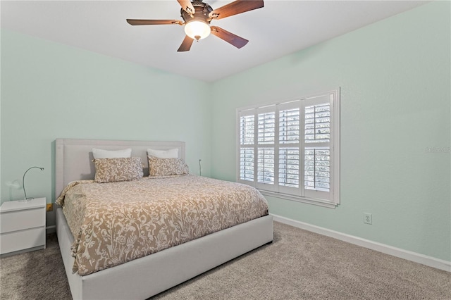 bedroom with baseboards, carpet flooring, and ceiling fan
