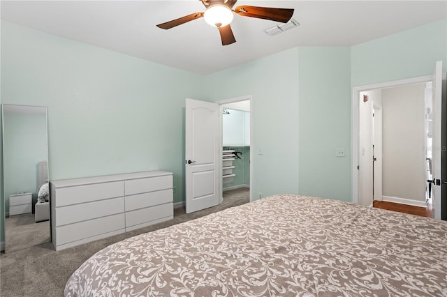 bedroom featuring baseboards, ceiling fan, carpet flooring, and visible vents
