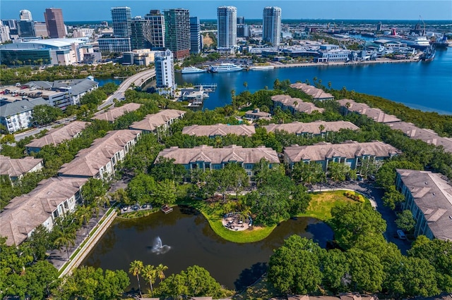 birds eye view of property with a city view and a water view