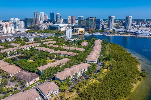 drone / aerial view featuring a water view and a city view