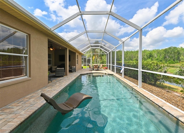 3254 Grassglen Pl, Wesley Chapel, FL 33544 - outdoor pool featuring an outdoor hangout area, a patio, a ceiling fan, and a lanai