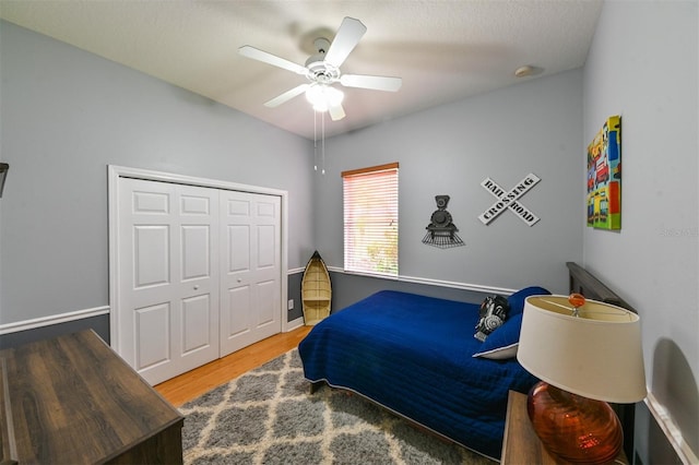3254 Grassglen Pl, Wesley Chapel, FL 33544 - bedroom with wood finished floors, a closet, and ceiling fan