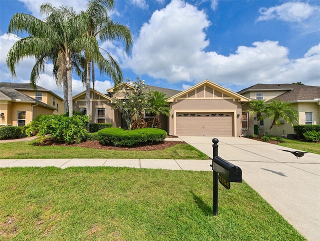 3254 Grassglen Pl, Wesley Chapel, FL 33544 - view of front of home with driveway, an attached garage, stucco siding, and a front yard