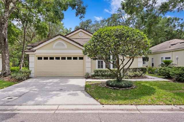 15314 Sherwood Forest Dr, Tampa, FL 33647 - obstructed view of property featuring a garage, stucco siding, concrete driveway, and a front yard