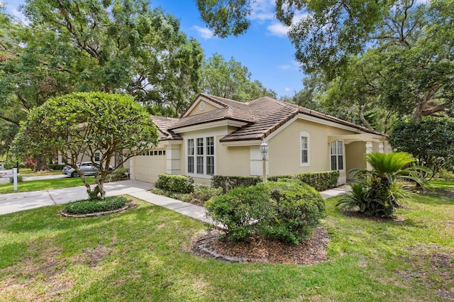 15314 Sherwood Forest Dr, Tampa, FL 33647 - single story home with driveway, a tiled roof, a garage, stucco siding, and a front lawn