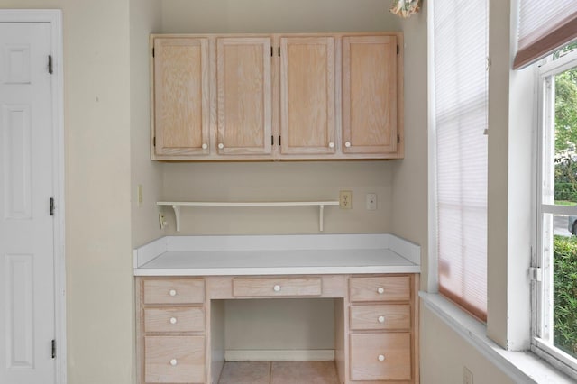 15314 Sherwood Forest Dr, Tampa, FL 33647 - unfurnished office with built in desk and light tile patterned floors