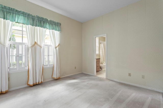 15314 Sherwood Forest Dr, Tampa, FL 33647 - spare room with plenty of natural light, carpet flooring, baseboards, and wallpapered walls