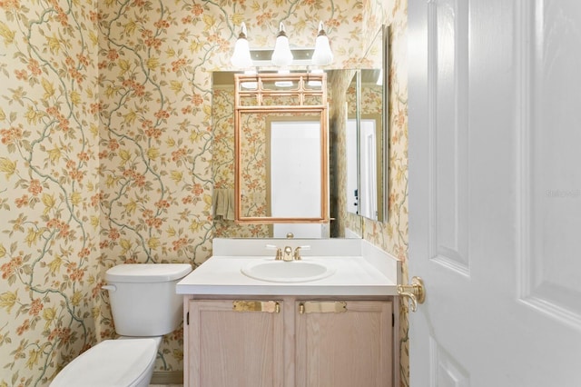 15314 Sherwood Forest Dr, Tampa, FL 33647 - half bathroom featuring wallpapered walls, toilet, and vanity