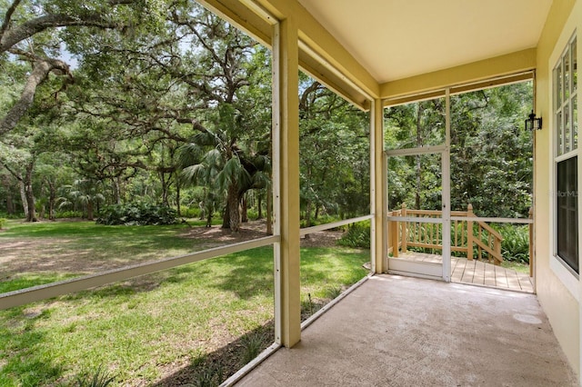 15314 Sherwood Forest Dr, Tampa, FL 33647 - unfurnished sunroom with view of scattered trees