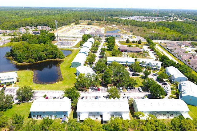 aerial view with a water view and a view of trees