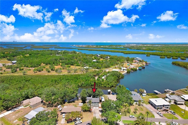 drone / aerial view featuring a residential view and a water view