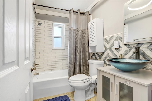 bathroom featuring tile walls, shower / bath combo with shower curtain, toilet, and vanity