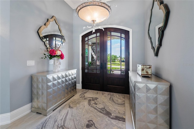 17305 Ballmont Park Dr, Odessa, FL 33556 - foyer with arched walkways, wood finished floors, and baseboards