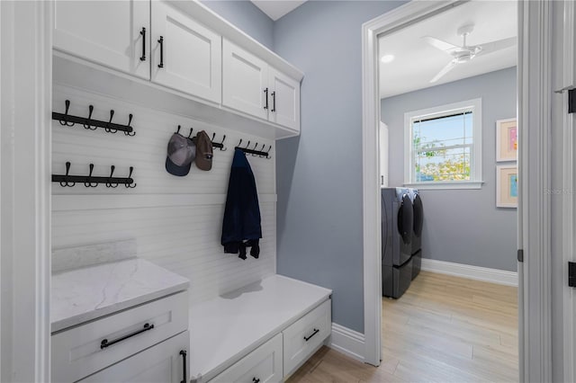 17305 Ballmont Park Dr, Odessa, FL 33556 - mudroom featuring light wood finished floors, washer and dryer, a ceiling fan, and baseboards