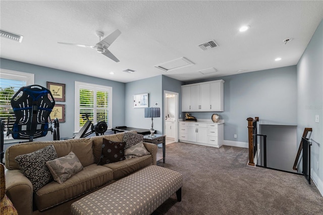 17305 Ballmont Park Dr, Odessa, FL 33556 - carpeted living area with attic access, visible vents, and baseboards