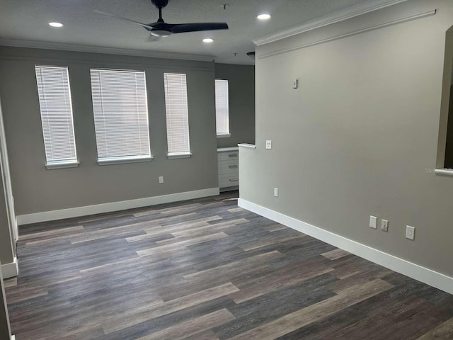 interior space with recessed lighting, dark wood-style flooring, ceiling fan, baseboards, and ornamental molding