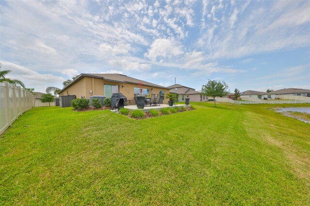 15426 Wicked Strong St, Sun City Center, FL 33573 - view of yard with a patio