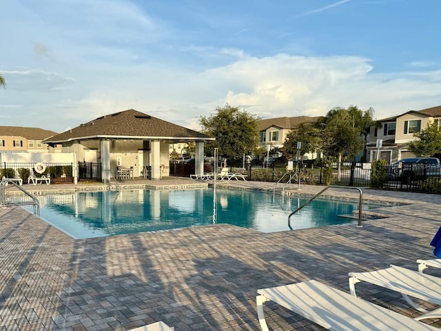 15426 Wicked Strong St, Sun City Center, FL 33573 - community pool with a patio