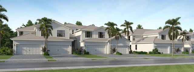 view of front of home with a residential view, concrete driveway, and a garage