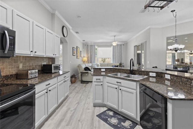 9723 Rolling Cir, San Antonio, FL 33576 - kitchen featuring a sink, electric stove, open floor plan, wine cooler, and ornamental molding