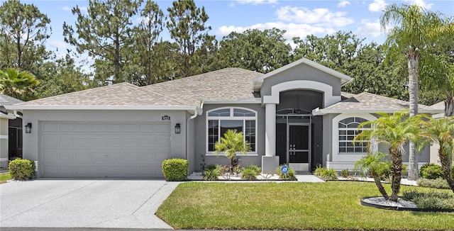 9723 Rolling Cir, San Antonio, FL 33576 - ranch-style house featuring a shingled roof, a front lawn, a garage, stucco siding, and concrete driveway