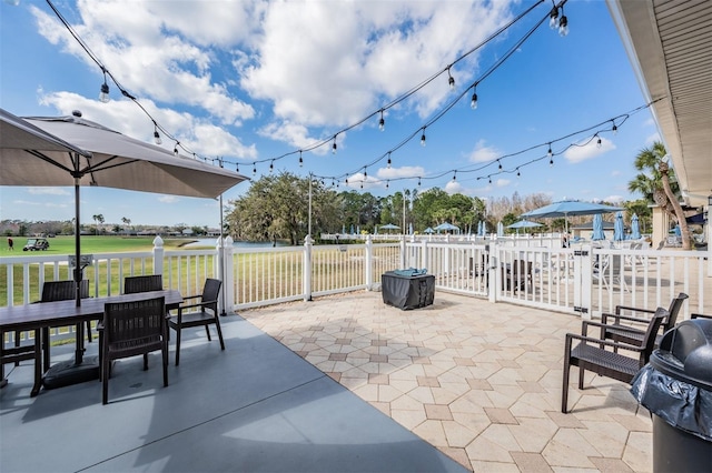 9723 Rolling Cir, San Antonio, FL 33576 - view of patio / terrace with fence and outdoor dining space