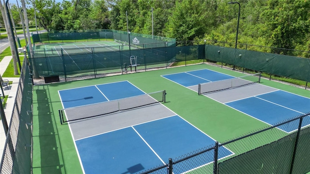 9723 Rolling Cir, San Antonio, FL 33576 - view of tennis court with community basketball court and fence