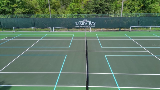 9723 Rolling Cir, San Antonio, FL 33576 - view of tennis court featuring fence