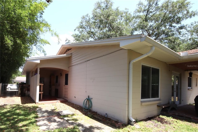 view of property exterior with fence