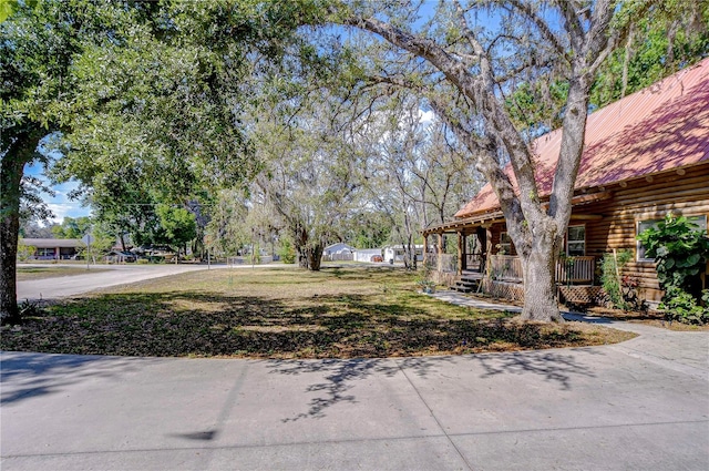 4126 Burrows Rd, Zephyrhills, FL 33542 - view of yard with covered porch