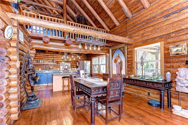 4126 Burrows Rd, Zephyrhills, FL 33542 - dining room with wood ceiling, rustic walls, hardwood / wood-style floors, and vaulted ceiling with beams