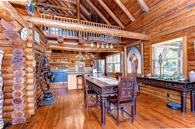 4126 Burrows Rd, Zephyrhills, FL 33542 - dining room featuring lofted ceiling with beams, hardwood / wood-style floors, rustic walls, and wood ceiling