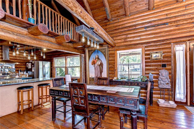 4126 Burrows Rd, Zephyrhills, FL 33542 - dining area featuring hardwood / wood-style floors, wooden ceiling, and beam ceiling