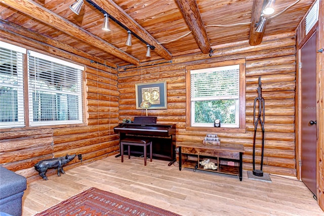 4126 Burrows Rd, Zephyrhills, FL 33542 - sitting room with rail lighting, beamed ceiling, and wooden ceiling