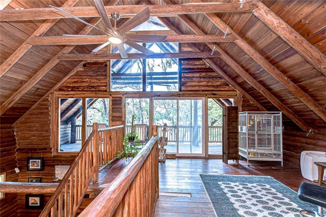4126 Burrows Rd, Zephyrhills, FL 33542 - unfurnished living room with vaulted ceiling with beams, wood ceiling, hardwood / wood-style floors, a ceiling fan, and log walls