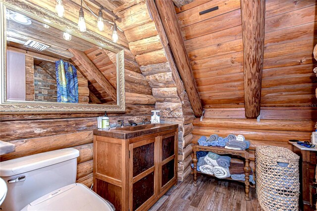 4126 Burrows Rd, Zephyrhills, FL 33542 - bathroom featuring wood ceiling, toilet, wood-type flooring, vanity, and log walls