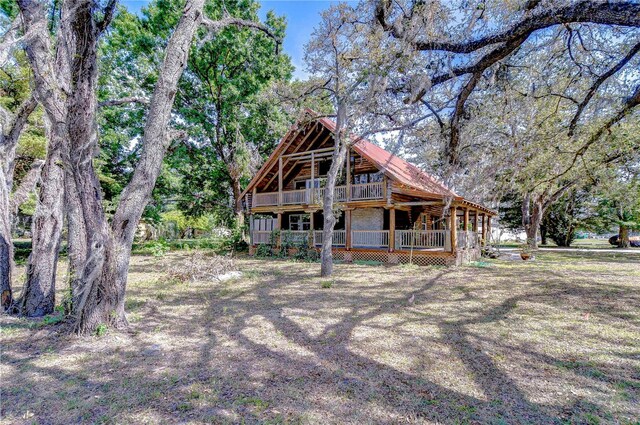 4126 Burrows Rd, Zephyrhills, FL 33542 - rear view of house with a deck
