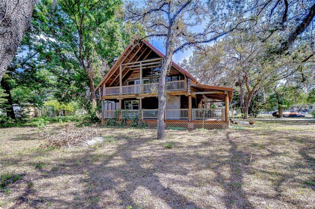 4126 Burrows Rd, Zephyrhills, FL 33542 - back of house with a wooden deck