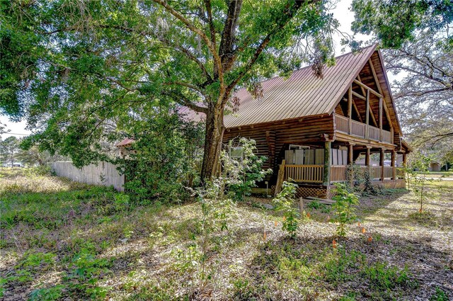4126 Burrows Rd, Zephyrhills, FL 33542 - exterior space featuring metal roof and log exterior