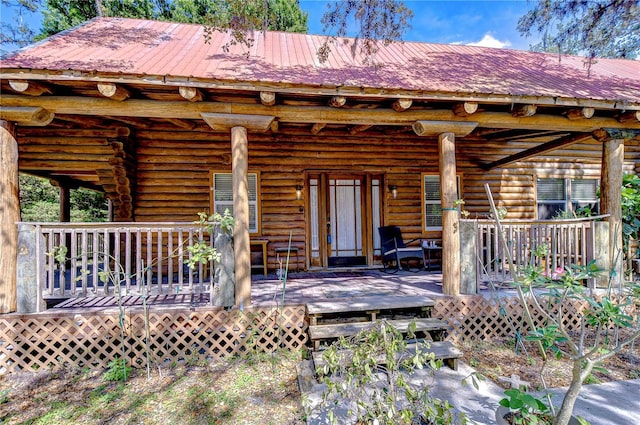 4126 Burrows Rd, Zephyrhills, FL 33542 - exterior space with log siding and metal roof