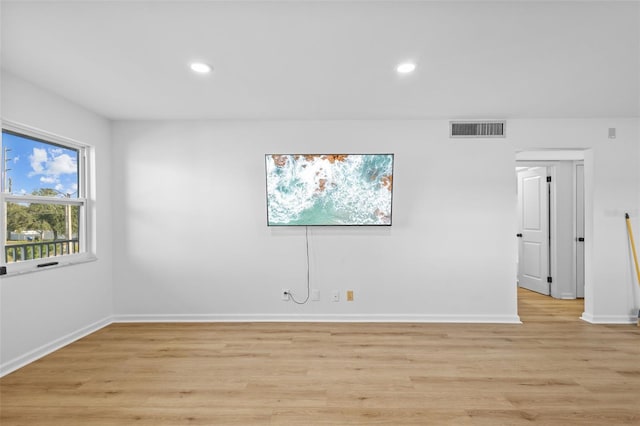 1225 58th St N Unit 204A, Saint Petersburg, FL 33710 - unfurnished room with light wood-type flooring, recessed lighting, and baseboards
