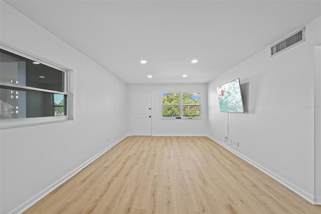 1225 58th St N Unit 204A, Saint Petersburg, FL 33710 - spare room with wood finished floors, recessed lighting, and baseboards